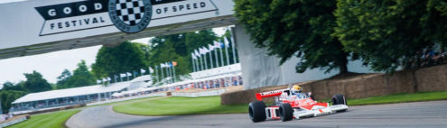 view of a racing car going around the goodwood race circuit at goodwood festival of speed