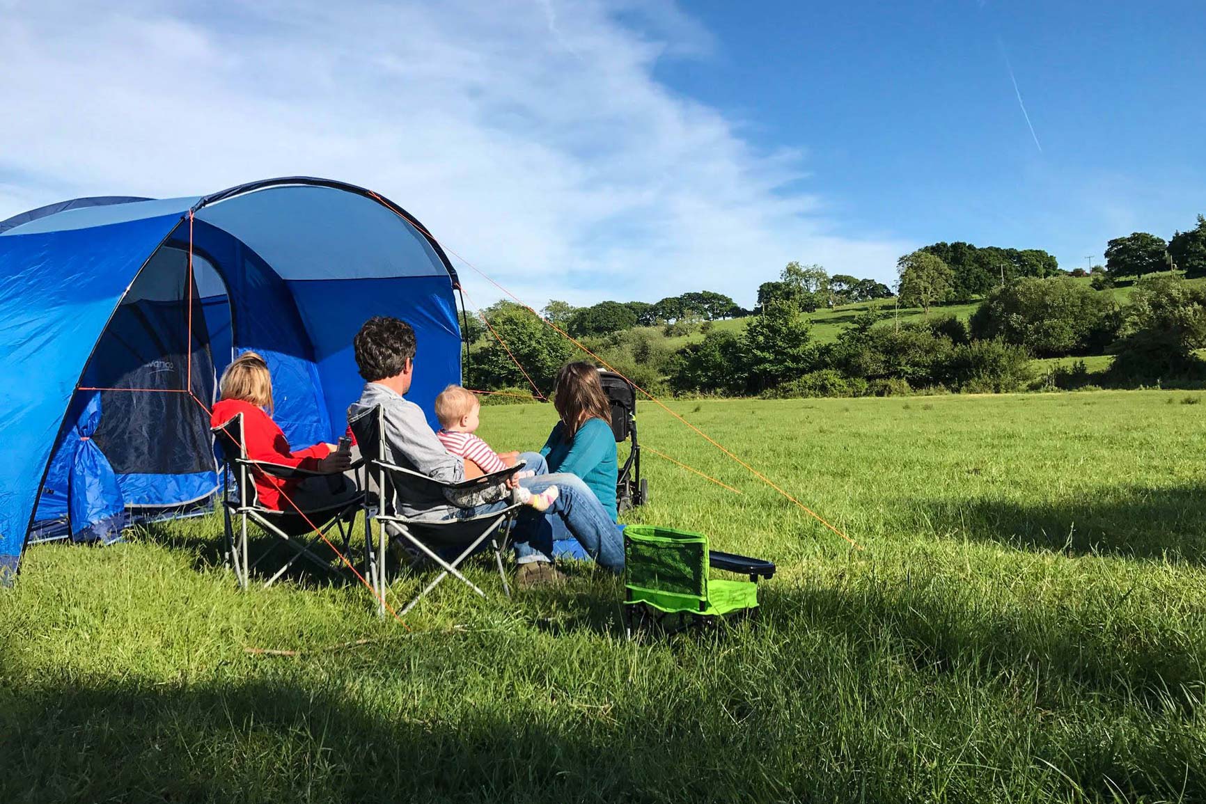 family camping in field at selden farm campsite