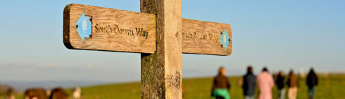 view of a sign pointing the direction of the south downs way